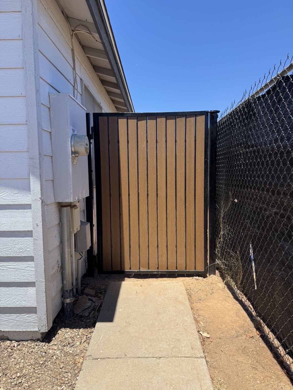 Custom single walkway gate with wood look composite slats